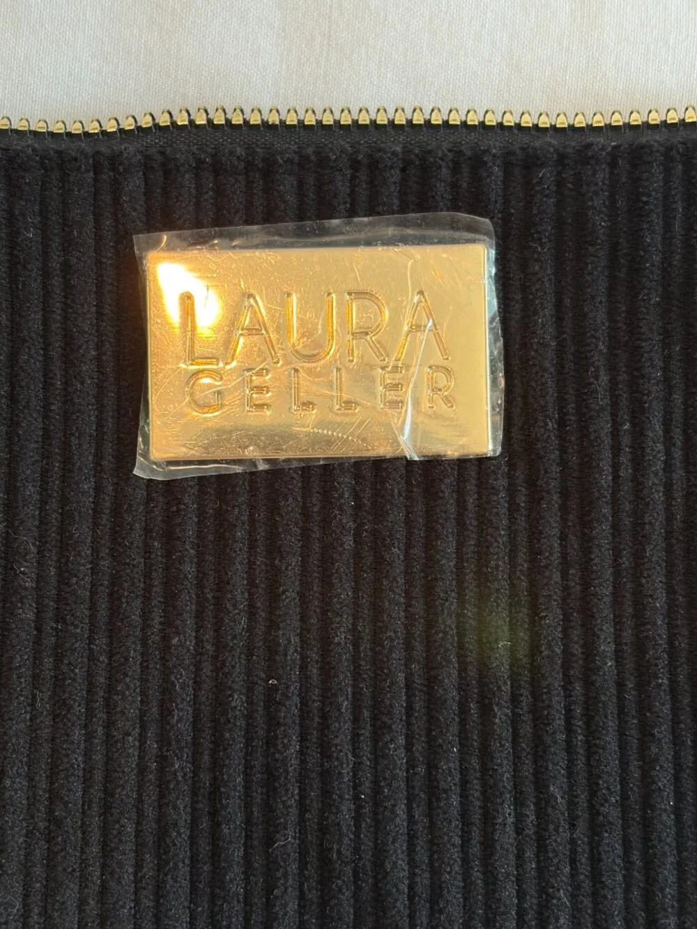 Laura Geller cosmetics bag black